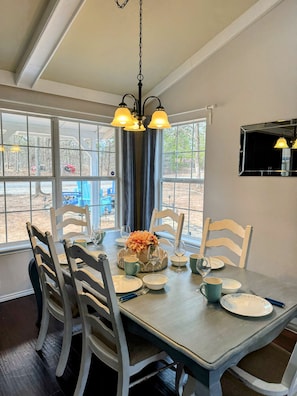 Dining room table with leaf to be able to accommodate more people around it.