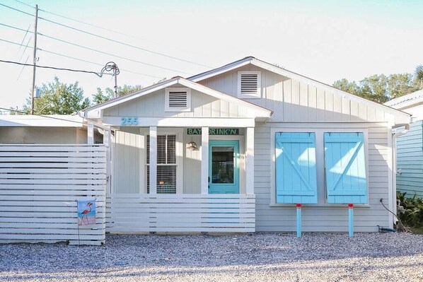 Front of Lost At Sea, Parking in front of double shutters and porch.