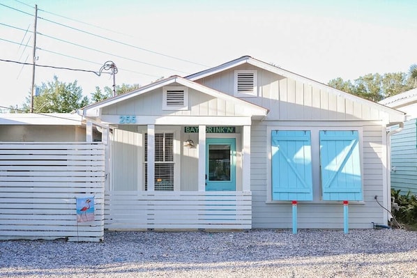 Front of Lost At Sea, Parking in front of double shutters and porch.