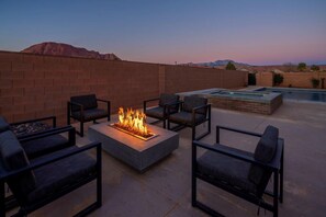 Private fire pit next to the pool and hot tub - perfect evening hangout space