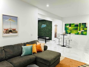 The downstairs game room has its own living room and cocktail lounge.