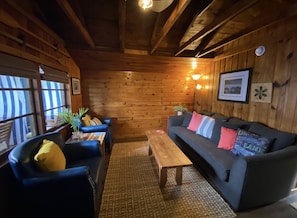 living room of cabin with all original wood