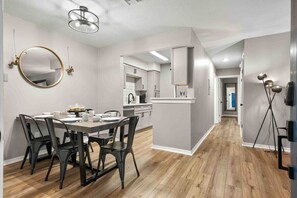 Open concept living/dining with dining seating for 6. Hallway to bedrooms and baths. 
