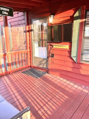 Screened front porch with smart TV. 