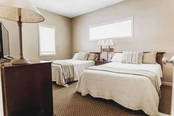 2 Queen Beds in spacious bedroom.