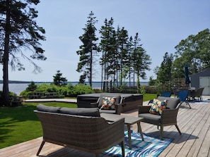 Large deck with furniture and hot tub