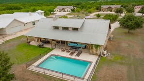 Aerial view of house + swimming pool