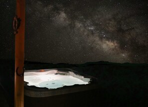 Relax in our hot tub and soak up the breathtaking view of the Milky Way.