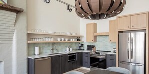 Fully equipped kitchen with full-size appliances and all the amenities of a home.