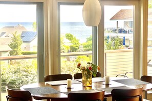 Dining area overlooking the sea and second floor deck