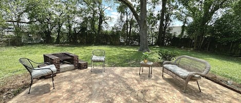 Great backyard and patio to chill, grill, or cozy up by the fire
