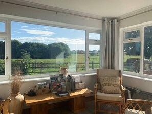 Sunny vistas from the Garden Room over to the Bain Valley