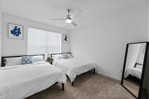 Two comfortable and cozy queen beds, spacious bedroom