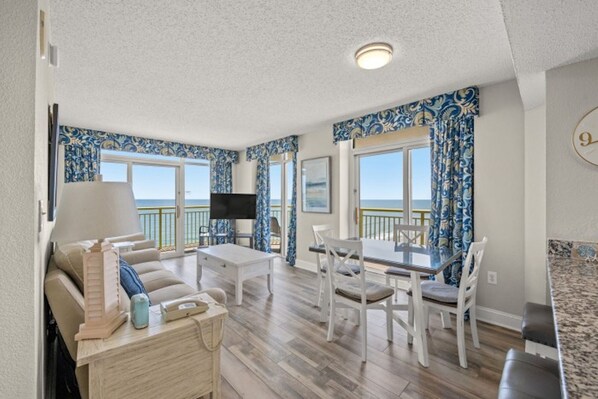 Let in the sunrays as you relax in the comfort of this living room with a view.