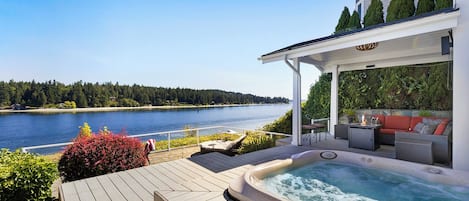 Hot tub overlooking the water to enjoy the sunrises and sunsets