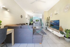 ZEN Westralia: 2-BR Cozy Inner-City Apt Near Shops - Our living room is your entertainment hub, complete with a smart TV, cozy seating, and board games for endless fun."