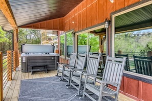 The back deck provides optimal options for relaxation with a private hot tub.