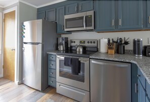 The fully equipped kitchen with stainless steel appliances and is stocked with everything needed to make delicious meals!