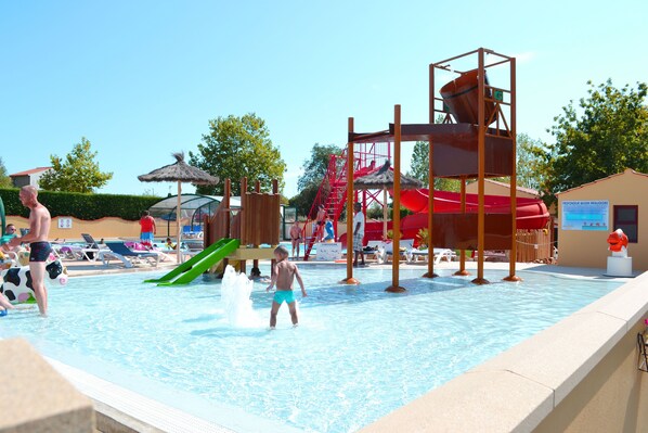 Vibrant water playground with multiple slides and splash areas, providing endless enjoyment for guests of all ages.