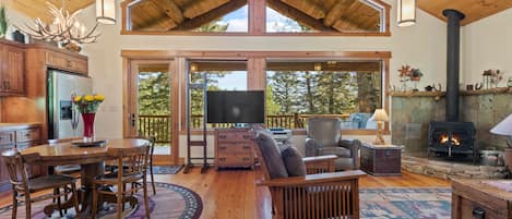 Living Room with Wood Burning Fireplace and TV