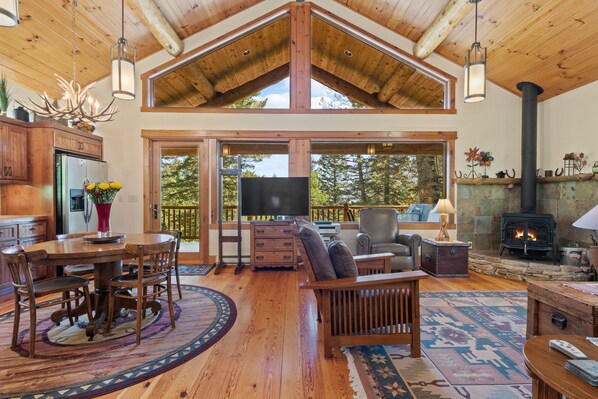 Living Room with Wood Burning Fireplace and TV