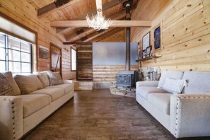 Spacious living room with cozy wood stove