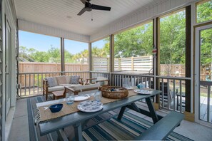 At the end of the Hall, come out to the Screened-In Back Porch to the Picnic Table for AlFresco Dining.