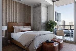 Combine productivity and relaxation in this queen bed with an office offering breathtaking city views.