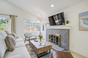 Living Room with Decorative Fireplace and HDTV