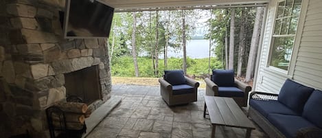 Patio fireplace with TV and seating for 8+! 