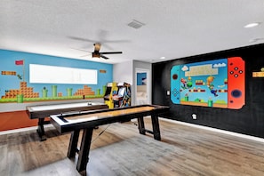 "Level up your vacation experience with our Mario and Luigi game room! Dive into the world of gaming and nostalgia with your friends and family. It's a place where fun knows no bounds, and epic adventures await. Book now to be the hero of your own story!