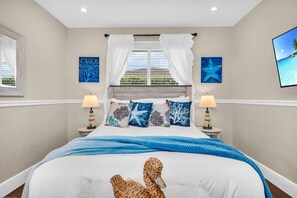 Enjoy the coastal feel of the second bedroom. The luxurious Tempur-Pedic adjustable queen-sized bed, is fully automated, with a massage function.