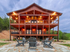 Enjoy surrounding mountain views from wrap around lower/upper deck or firepit