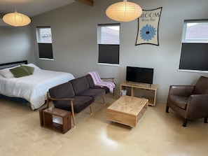 Main living area with queen bed sleeping are behind