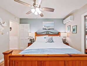 Cal-King Size Bed with AC, TV, 2 closets and a ceiling fan and chair