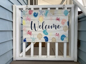 Welcome to our home! This gate at the top of the stairs keeps little ones safe. 