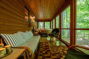 Screened-in Lounge Seating with beautiful views of Michigan's trees
