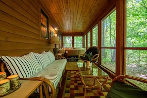 Screened-in Lounge Seating with beautiful views of Michigan's trees