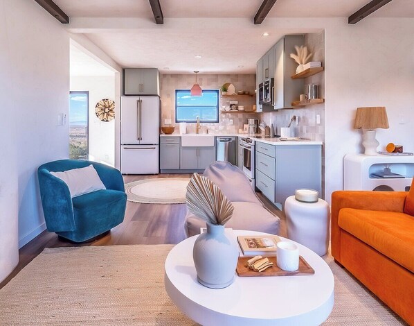 One level 900 square foot home with stunning views, open-concept living and ample lighting.