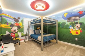 Step into our beautiful and vibrant Mickey Mouse themed kids' room, complete with bunk  beds. This spacious and comfortable haven is perfect for your little ones to unwind and let their imaginations soar after a day of vacation excitement. Full over full bunk bed
