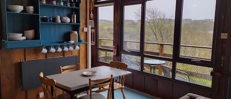 The dining area looking onto the valley and deck