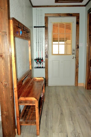 Side entry with Fishing Poles and supplies