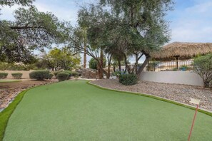 Desert-inspired landscaping offers a serene and private atmosphere.