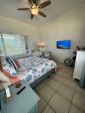 Clean and cozy beach-themed bedroom