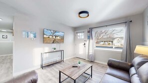 Great sunlight! Great couches! Huge TV