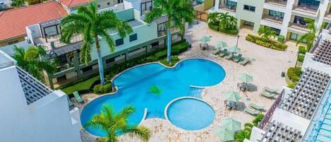 Enjoy your day with this crystal blue outdoor swimming pool.