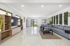 Feel confident welcoming your friends in this spacious and cozy living room
