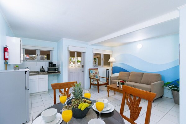 A  sufficient space enough for dining area, living room, and kitchen.