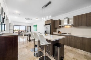 A living room and dining room space that has a bright interior, and minimalist interior design.