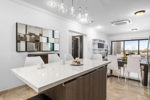 Modern and sleek living/dining/kitchen area.